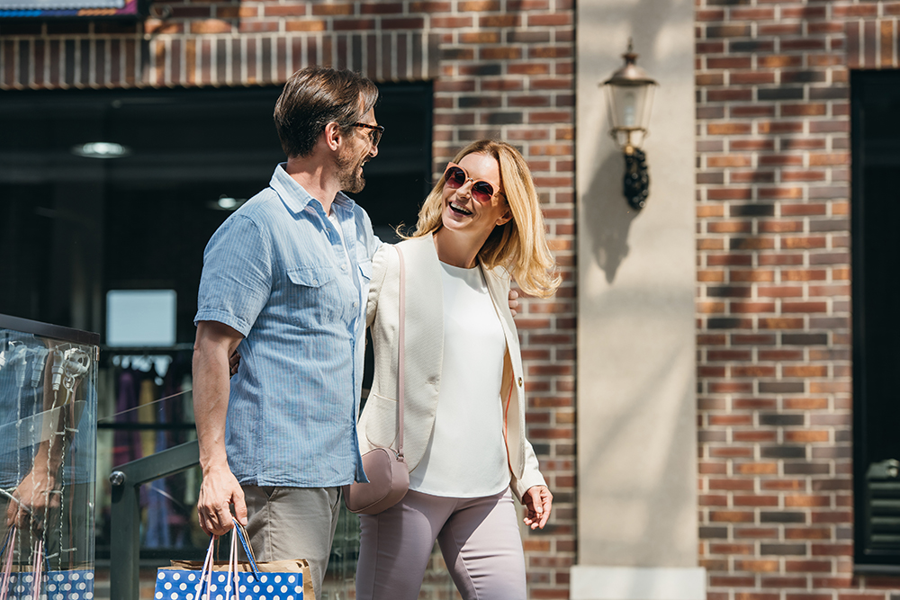 Couple shopping in sunglasses